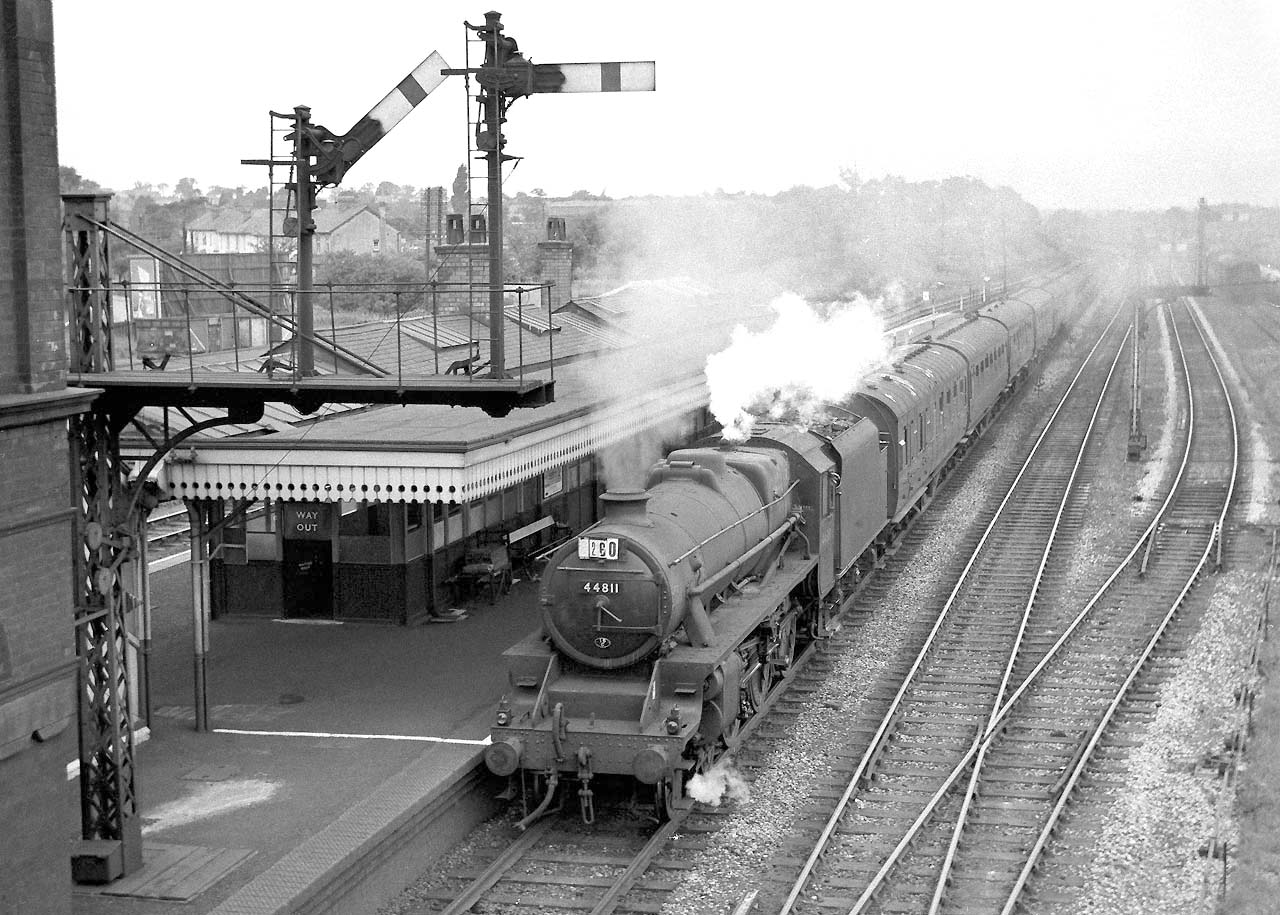 Ex-LMS 5MT 4-6-0 No 44811 passes through the station with a Class A express service for Nuneaton circa 1960
