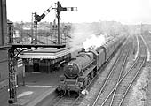 Ex-LMS 5MT 4-6-0 No 44811 passes through the station with a Class A express service for Nuneaton circa 1960