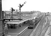 Ex-LMS 5MT 4-6-0 No 44918 heads a Class A express service through the station bound for Derby circa 1960