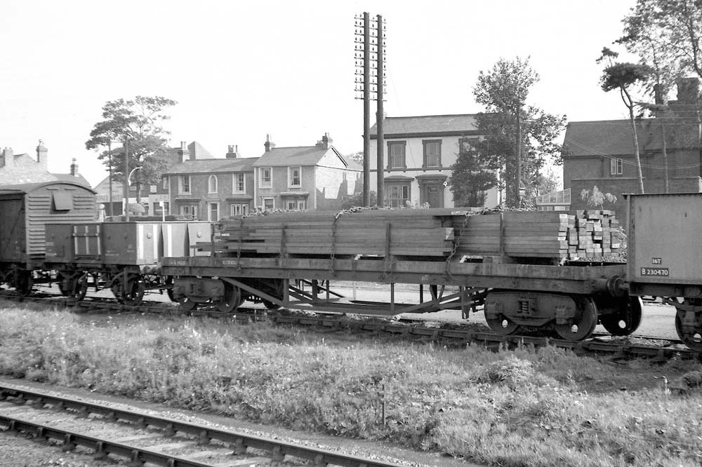 A British Railways Bogie Bolster 'C', No B943423, is seen loaded with timber at Water Orton circa 1959