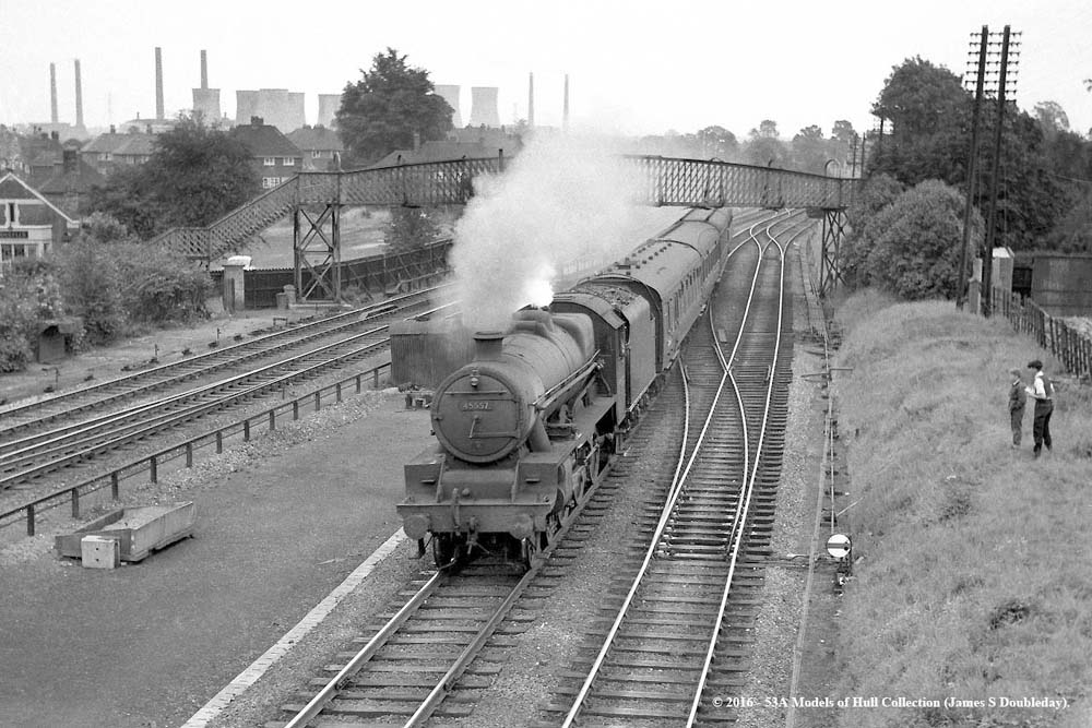 Ex-LMS 5XP 4-6-0 No 45557 'New Brunswick' approaches Water Orton station with a Class B Derby to New Street service