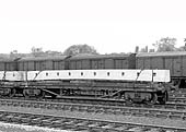 A British Railways Bogie Bolster 'C', No B943870, is seen loaded with a pre-stressed concrete beam at Water Orton circa 1959