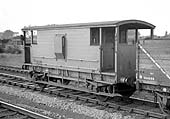 A former LMS 20 ton Goods Brake Van, No M730527, is seen attached to the rear of a passing up goods at Water Orton circa 1959