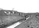View of Birmingham Sewage Farm's outfall conduit passing beneath the railway and the occupation over bridge, near Water Orton