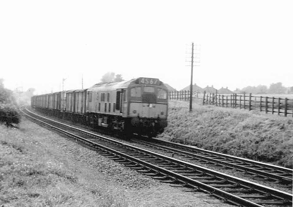 An unidentified British Railways Brush Type 2 diesel locomotive enters the cut off line for Kingsbury line with a freight service