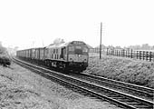 An unidentified British Railways Brush Type 2 diesel locomotive enters the cut off line for Kingsbury line with a freight service