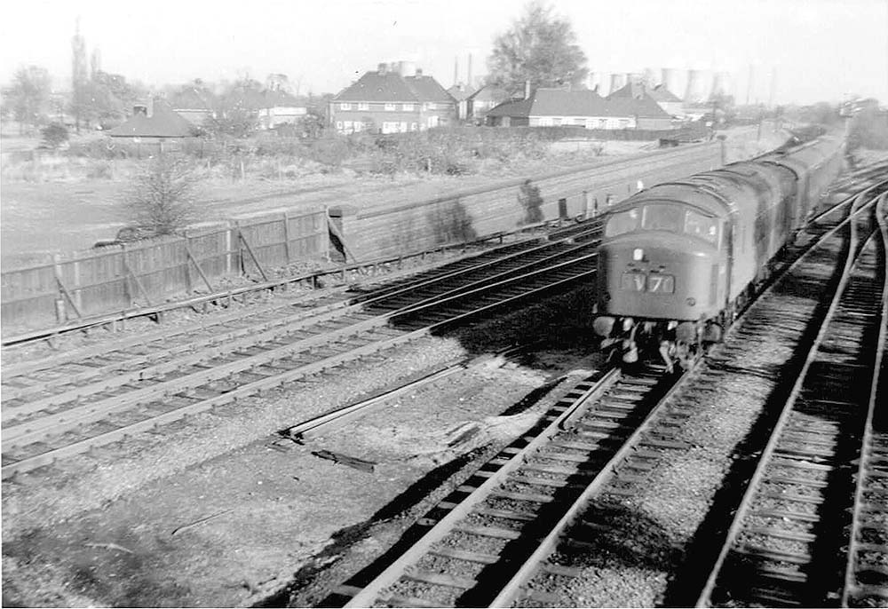 An unidentified British Railways Sulzer Type 4 diesel locomotive is seen coming off the line from Derby with an express service