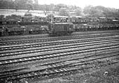 BR Diesel Shunter 0-6-0 D3775 runs past empty wagons at Water Orton goods sidings in the early 1960s