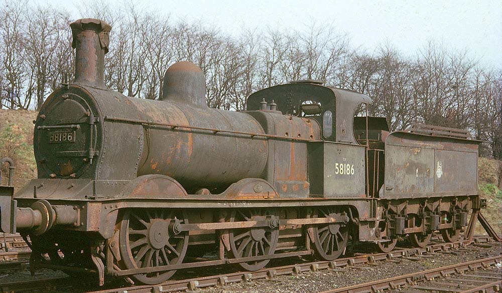 Ex-MR 2F 0-6-0 No 58186 stands hard against the buffers in the stowage siding opposite the goods yard in March 1962