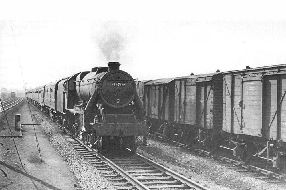 British Railways built Caprotti 5MT 4-6-0 No 44744 approaches the station on an up express from Bristol