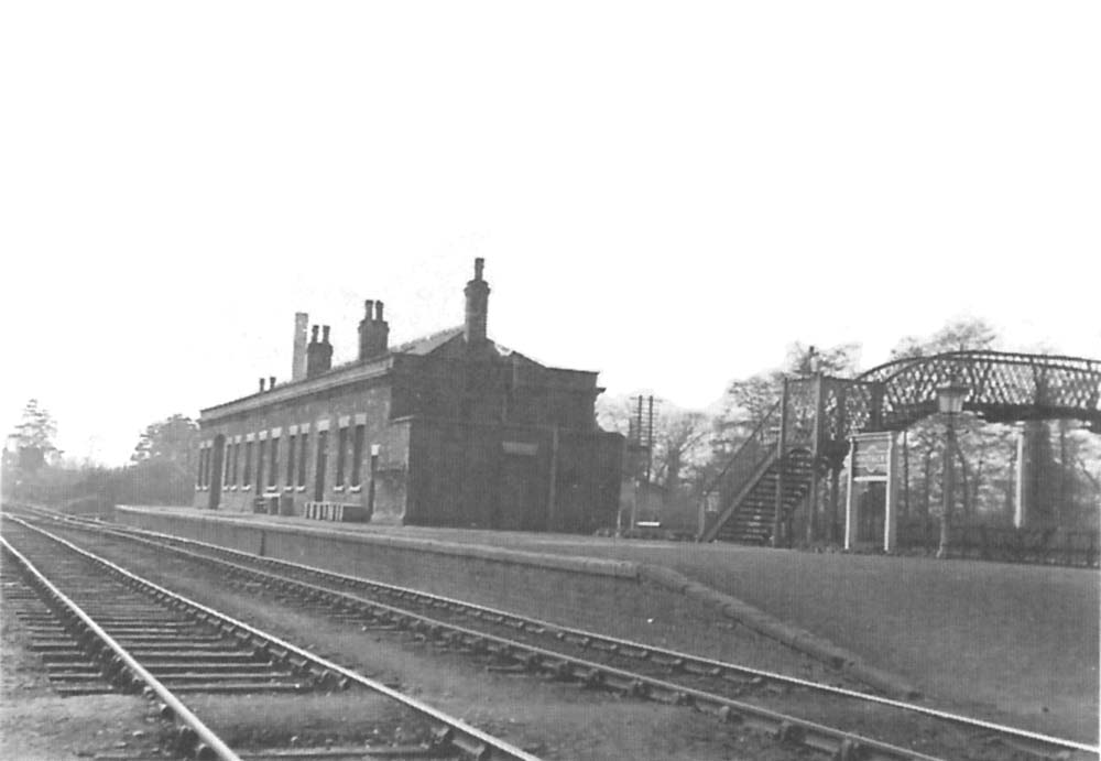 Looking along the Hampton branch platform from the Leicester end of Whitacre Station on 8th March 1956