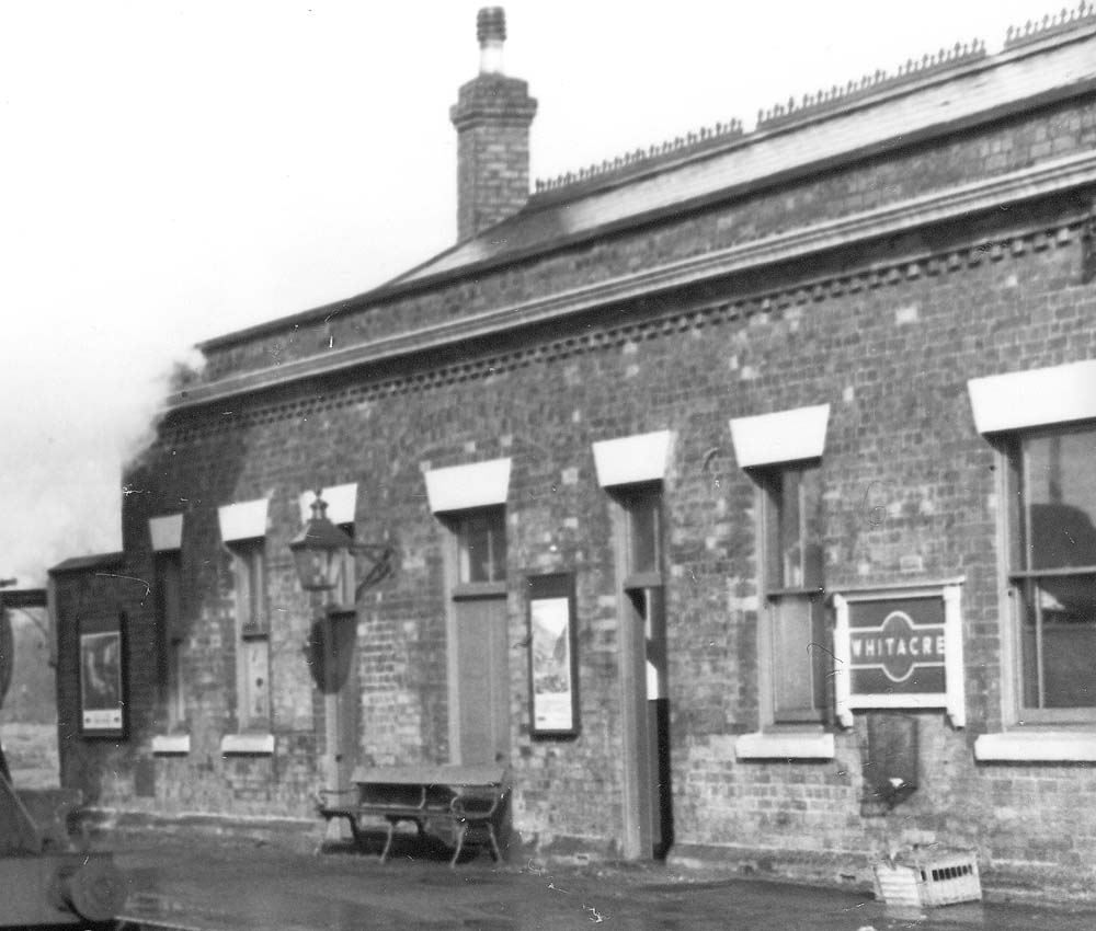 Close up showing some of Whitacre station's facilities in the main building on the island platform
