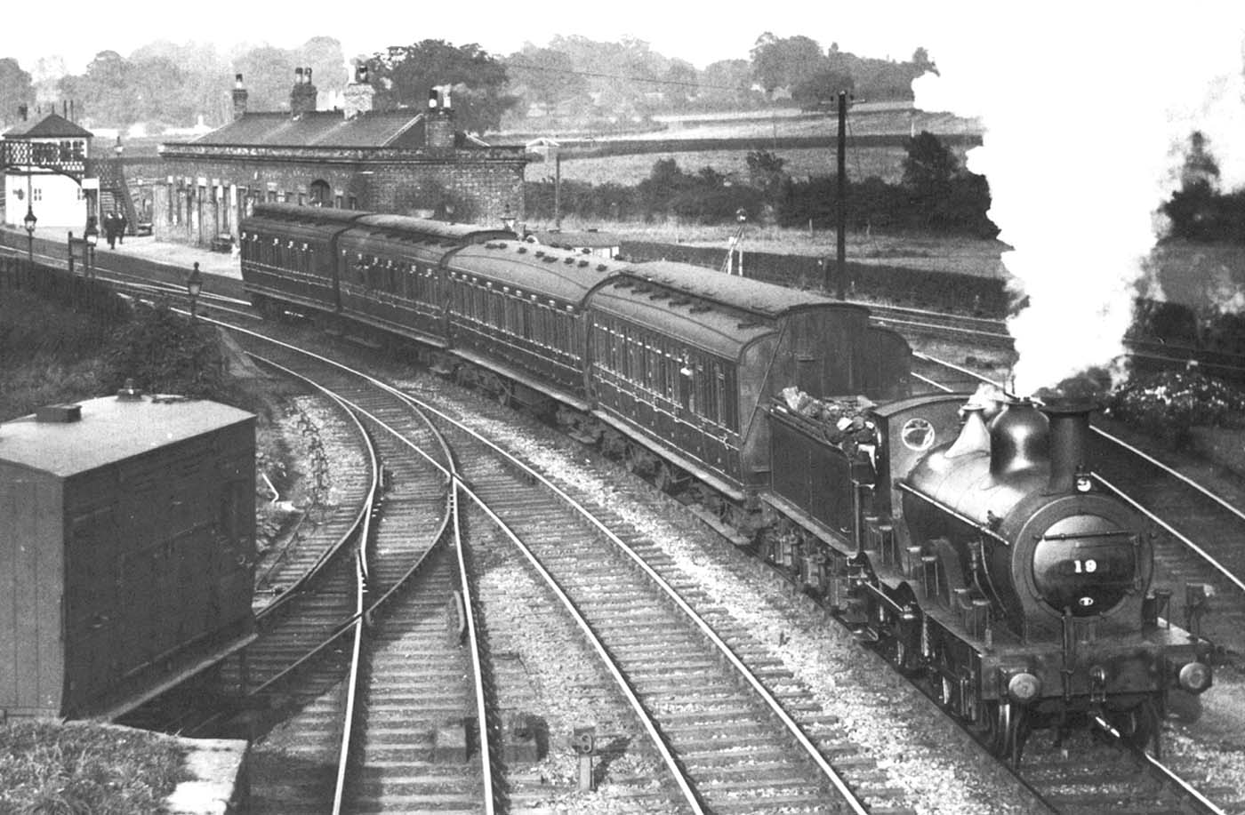 Ex-MR 1P 2-4-0 No 19 heads a westward bound local out of Whitacre Junction station, just after the grouping of 1923