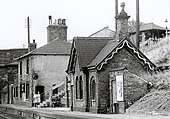 Close up of the structures on the down platform with at least three different brick buildings evident