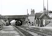 Looking towards Tamworth as ex-LMS 5XP 4-6-0 No 45696 'Arethusa' passes under the A5 road bridge circa 1961