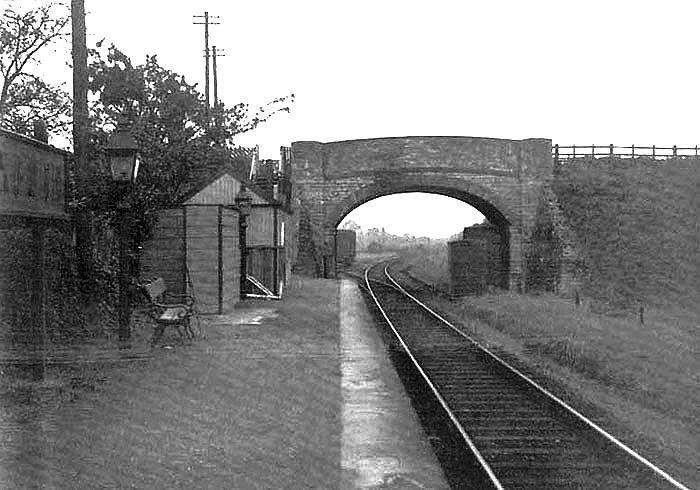 Looking north along Wixford station's single platform with access being available via the footbridge to the road on the left