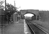Looking north along Wixford station's single platform with access being available via the footbridge to the road on the left