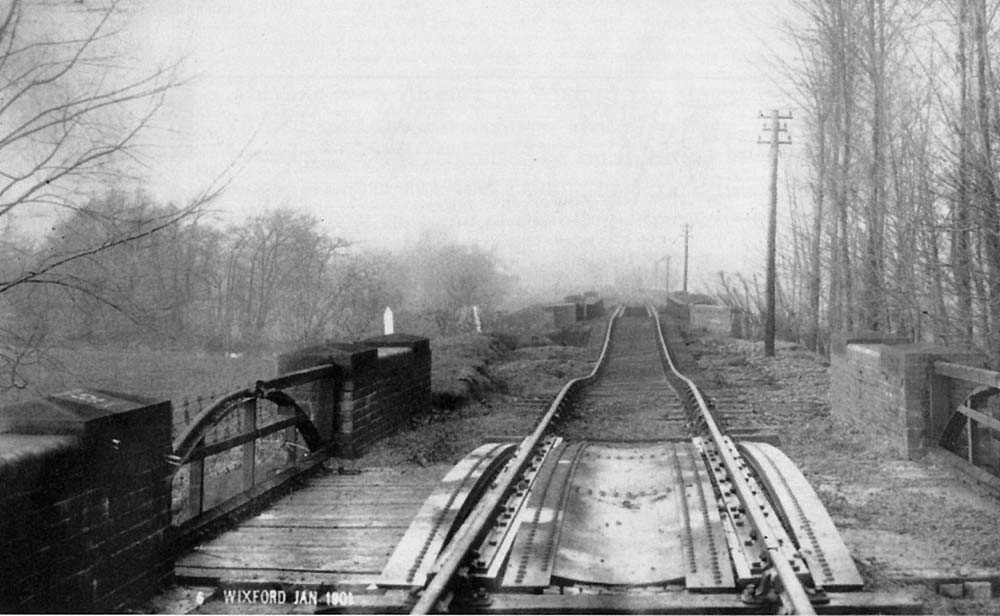 Looking towards Alcester to the north of Wixford station after the River Arrow flooded its banks at the beginning of the 20th century