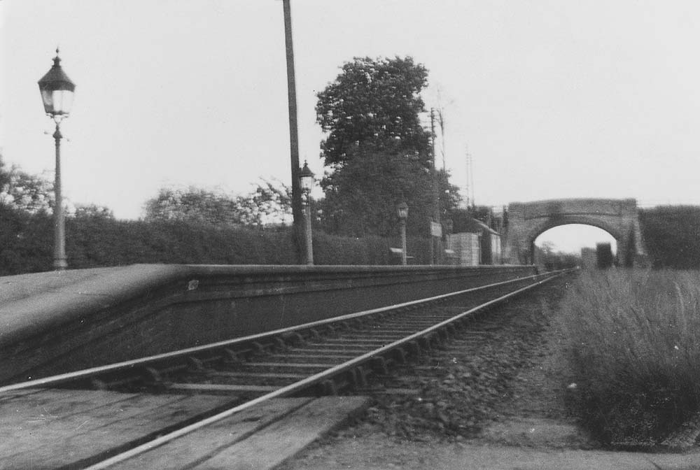 Looking along the full length of Wixford station's platform towards Broom with the passenger buildings at the Broom end of the station