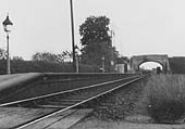 Looking along the full length of Wixford station's platform towards Broom with the passenger buildings at the Broom end of the station