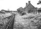 View along Binton station's abandoned platform towards Broom Junction with on the left the still used but overgrown single line