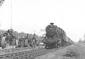 Ex-LMS 8F 2-8-0 No 48204 passes by Binton station at the head of a mineral train on 25th April 1960