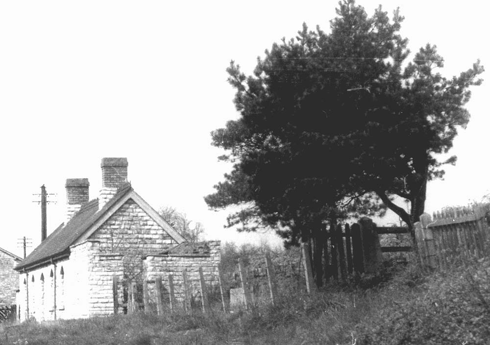 Close up of Binton passenger station after closure showing the platform sign pointing to gentlemen's toilets has been removed