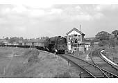 BR Standard Class 9F No 92205 having waited for ex-WD 'Austerity' 2-8-0 No 90065 now collects the staff in order to pass to Stratford upon Avon on 15th May 1960