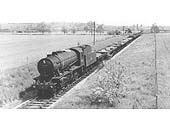 Ex-WD 2-8-0 'Austerity' No 90201 is seen on a Class H through working with a train of steel billets between Broom and Stratford