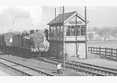 Close up showing the exchange of tokens between the 'bobby' of Clifford Sidings Signal Box and the engine crew