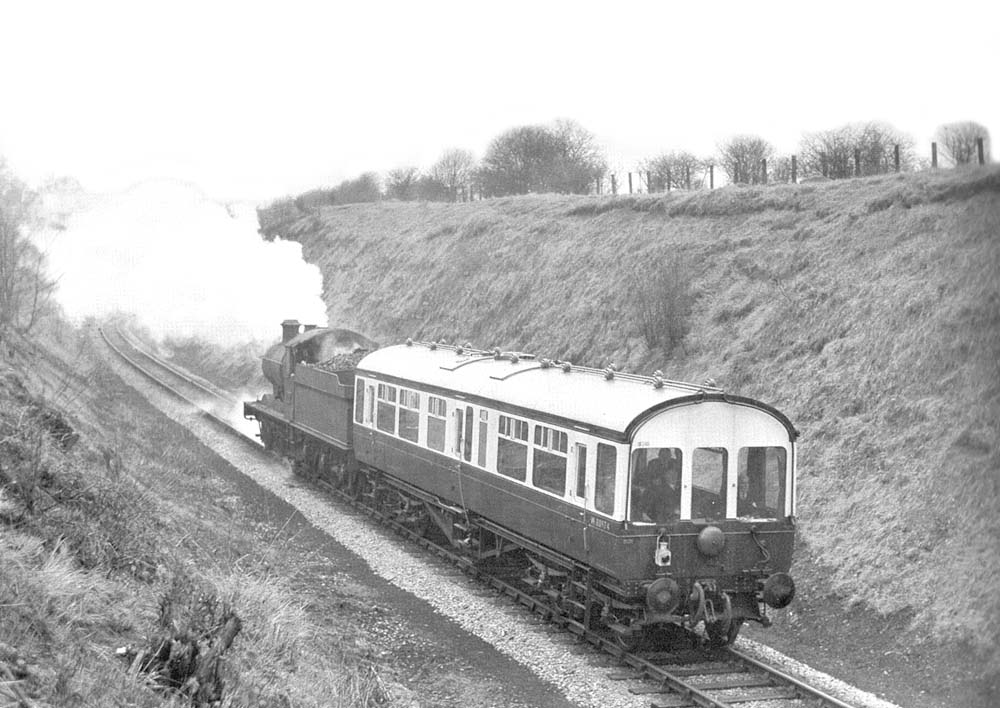 Ex-Great Western Railway 0-6-0 2251 class, No 2274 with Inspection Saloon No 80974 in Goldicote Cutting, near Ettington on the SMJR on 27th March 1958