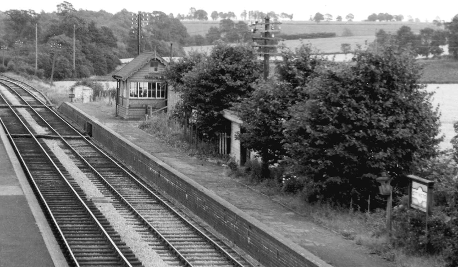 Close up showing Ettington station's down platform and its waiting room plus the platform sited signal box
