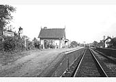 Looking towards Kineton from beneath the bridge during LMS days, as indicated by the poster boards on display