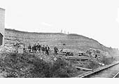 Men from the crushing plant pose with their bicycles with the E&WJR main line in the foreground