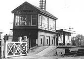 Close up of the joint signal box and Fenny Compton SMJ station's up platform waiting room and store