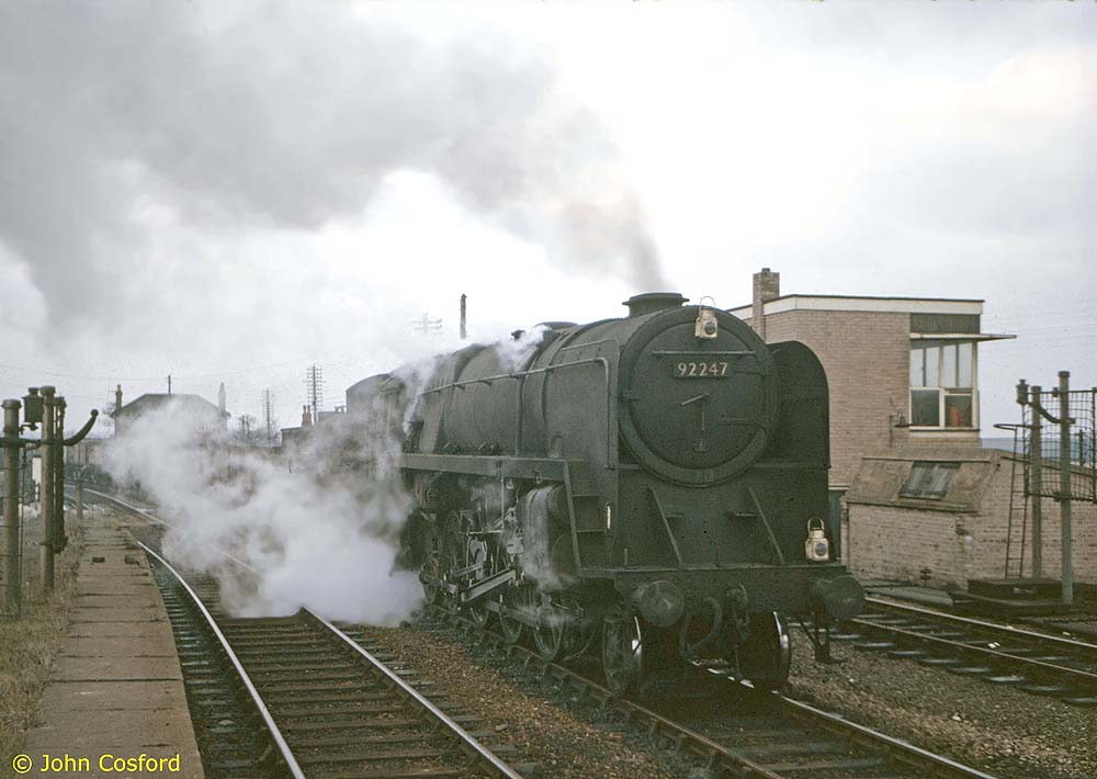 British Railways Standard Class 9F 2-10-0 No 92247 passes through the now demolished ex-SMJ Fenny Compton station with an eastbound freight