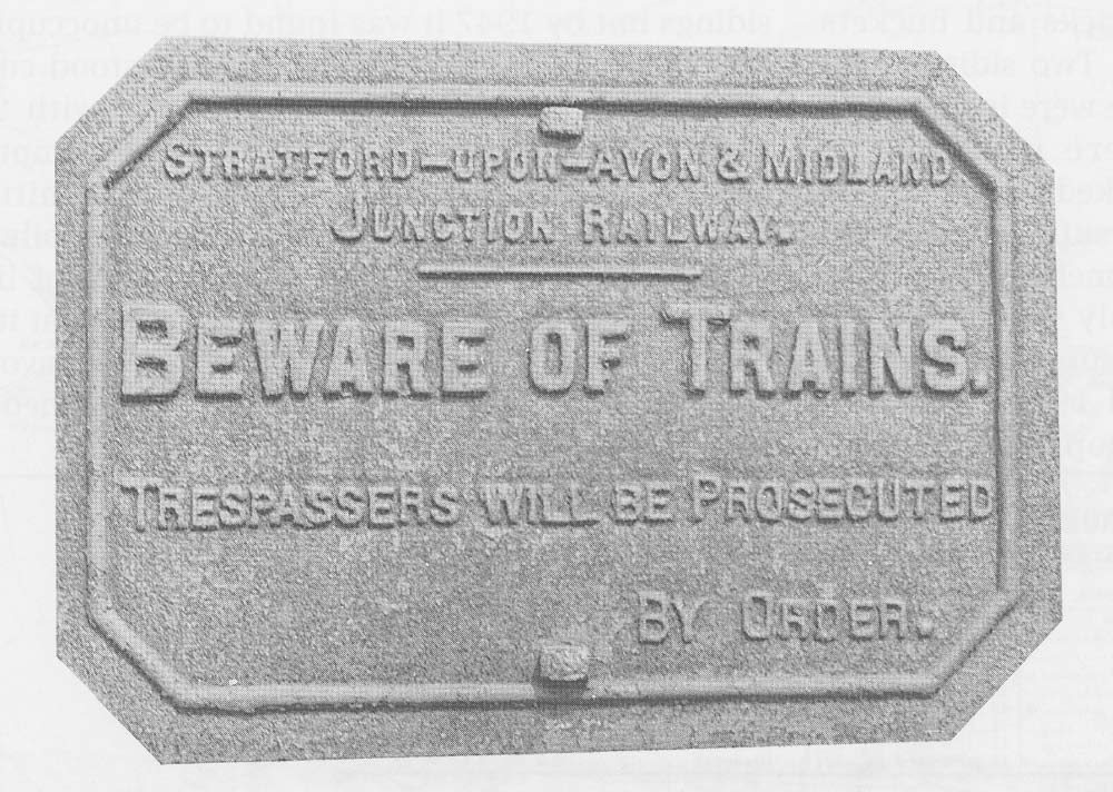 A photograph of an Stratford Midland Junction 'Beware of the Trains' cast-iron warning sign