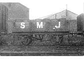A Stratford Midland Junction 4-plank open wagon carrying goods packed in barrels