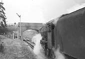 Ex-LMS 8F 2-8-0 No 48392 gets the right away from Kineton to Fenny Compton on 10th January 1964