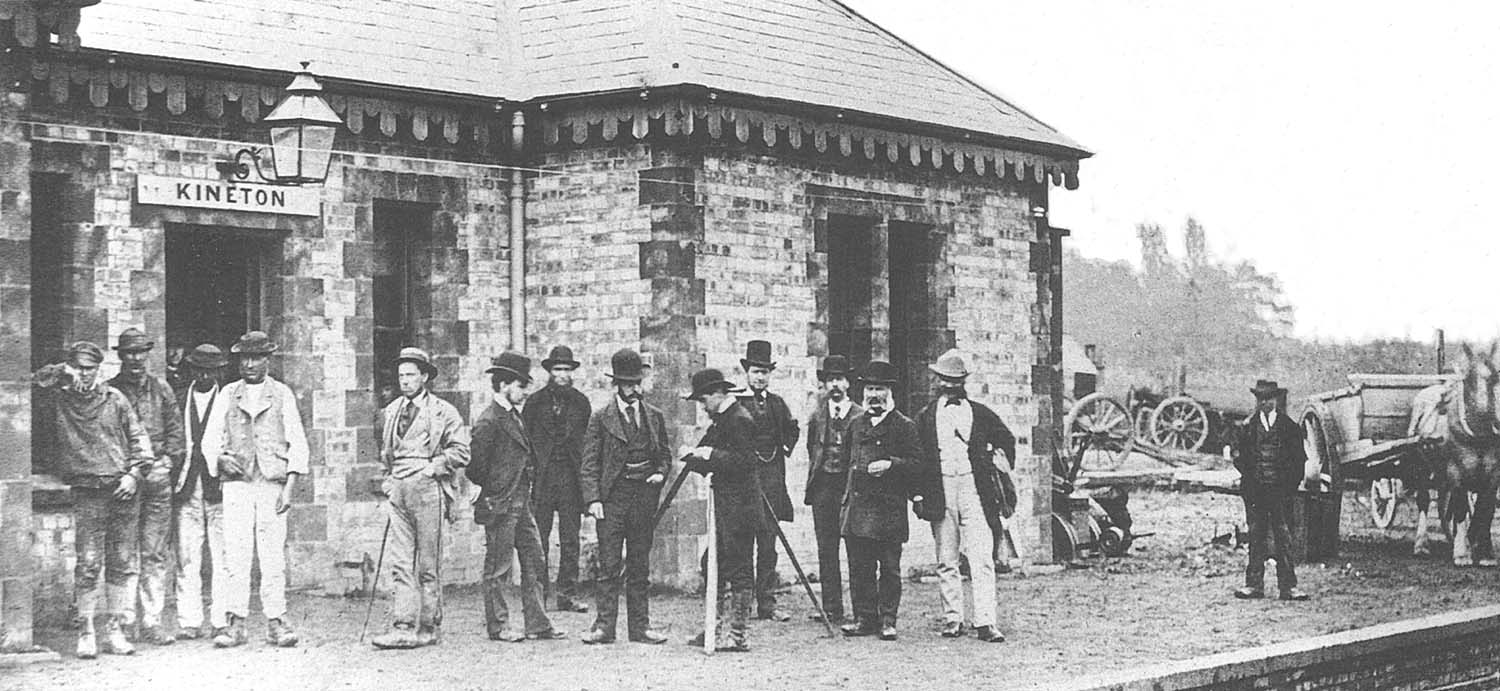 An eclectic mix of people gather on the platform of Kineton station prior to the station being opened in 1871