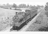 East of Kineton looking towards Burton Dassett on Boundary Farm road bridge as ex-MR 3F 0-6-0 No 3698 passes beneath