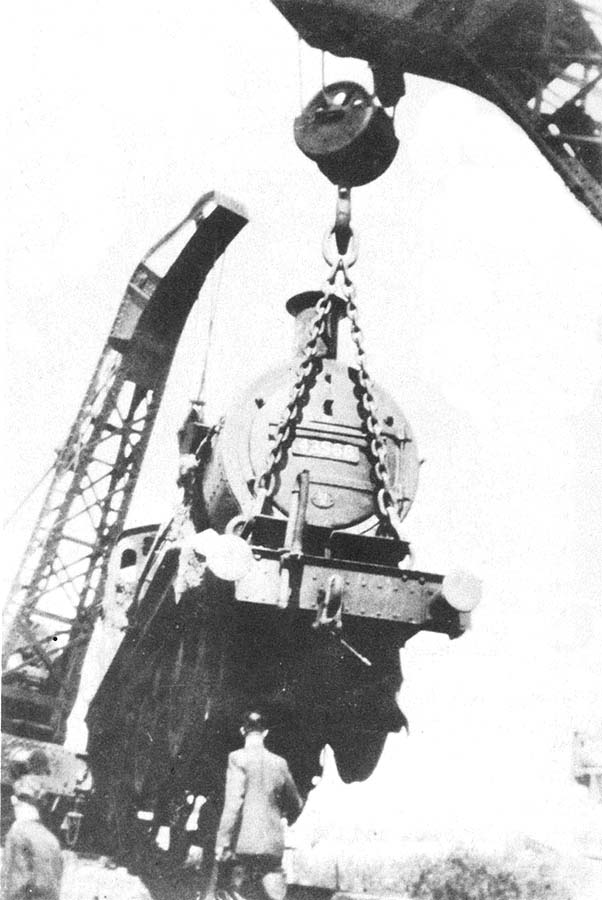 Ex-LMS 4F 0-6-0 No 43568 is being lifted clear having collided with a low-loader stuck on a level crossing near Kineton