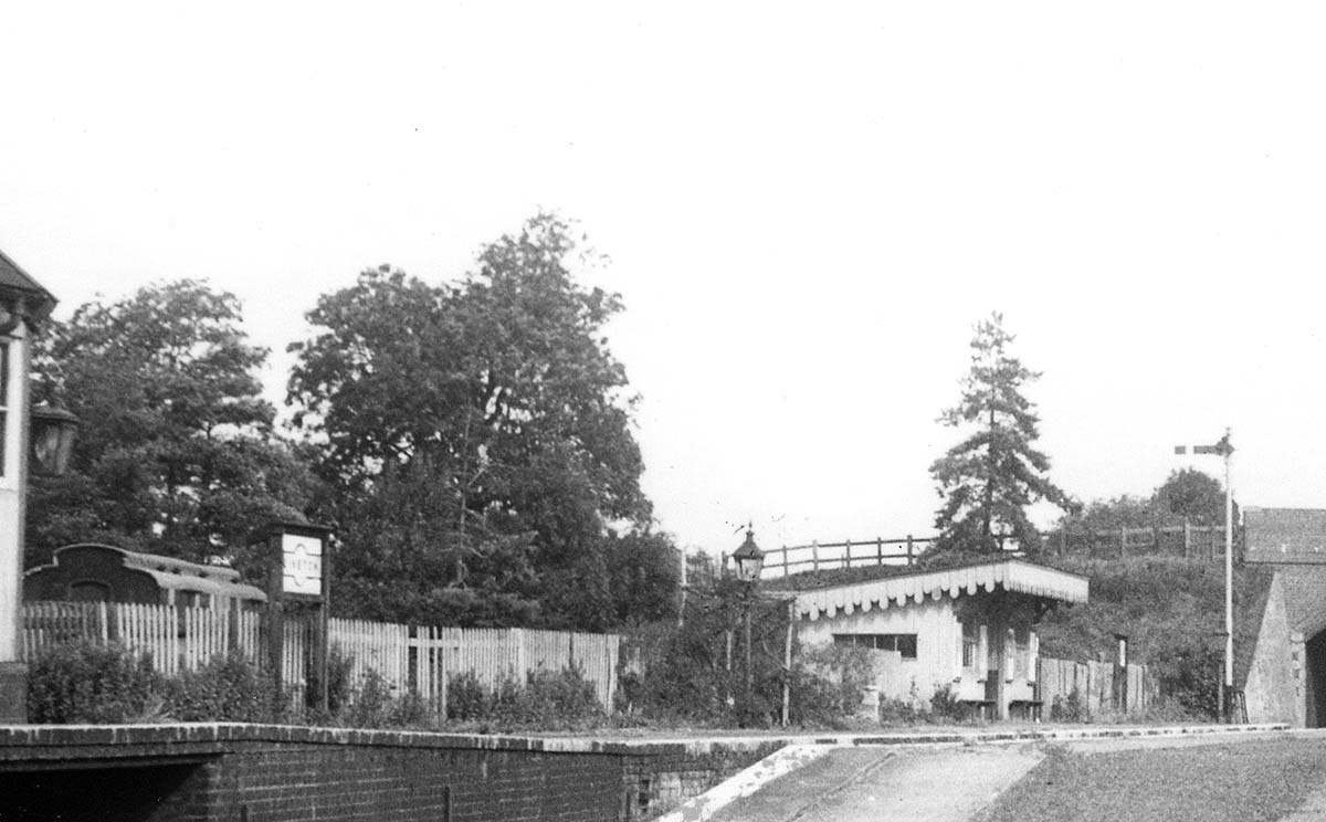 Close up showing the standard LMS 'Running-in' board with the clerestory coach standing in the yard behind