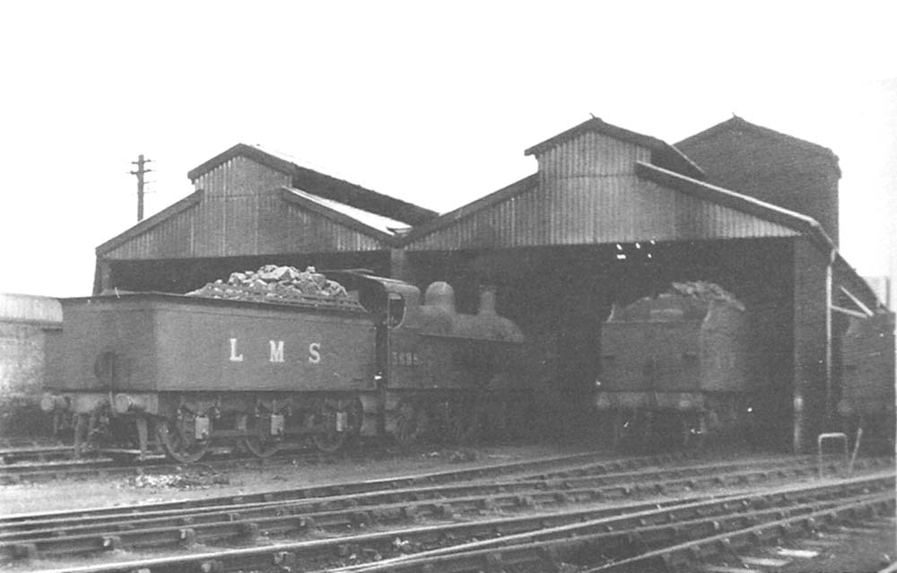 Ex-MR 4F 0-6-0 No 3895 stands fully coaled outside the shed alongside two other LMS 4F 0-6-0s on 23rd March 1947