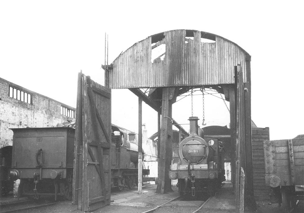 Ex-MR 3F 0-6-0 No 3695 stands alongside fellow classmate inside the shed during reconstruction