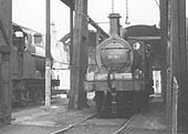 Close up showing ex-MR 0-6-0 No 3695 standing over one of the inspection pits inside the shed