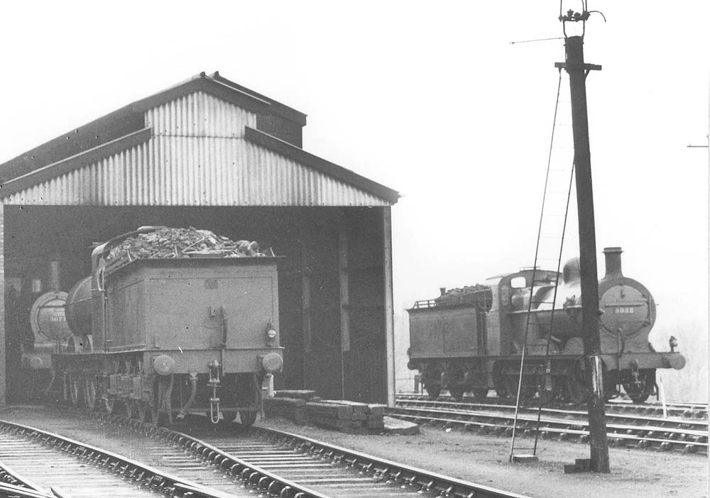 Close up showing the new shed's No 3 and No 4 road with ex-MR 3F 0-6-0 No 3077 facing towards the camera on the left