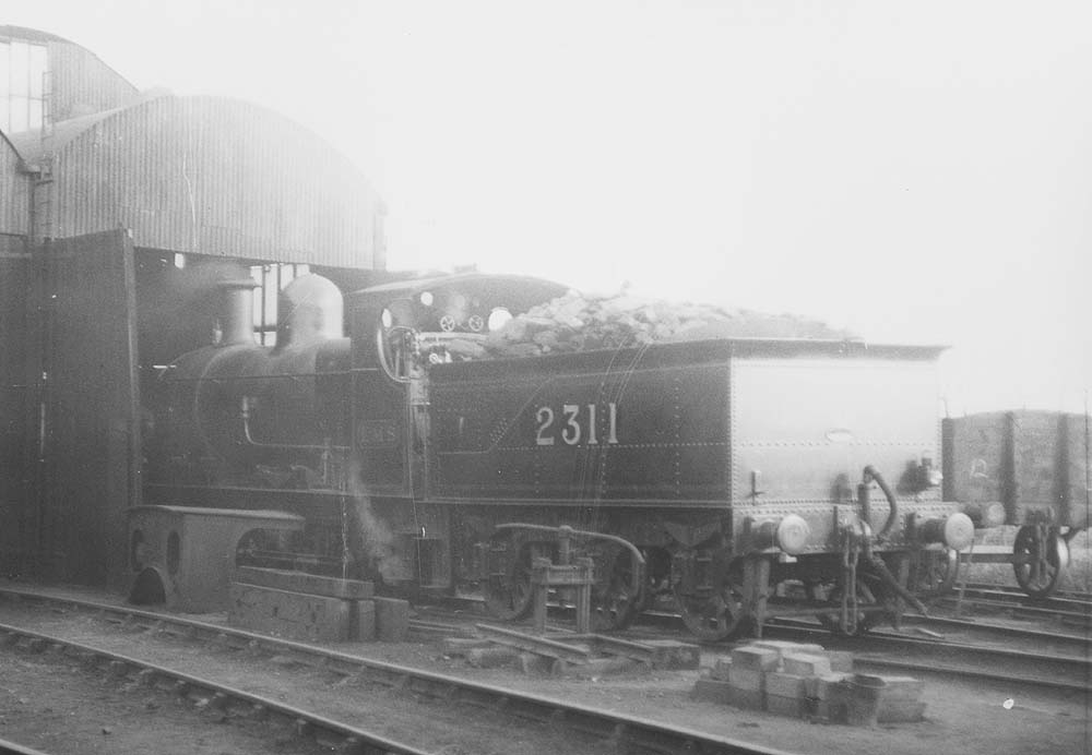 View of ex-SMJ 0-6-0 No 2311, formerly SMJ No 18, standing on No 4 road outside the shed on 8th April 1924