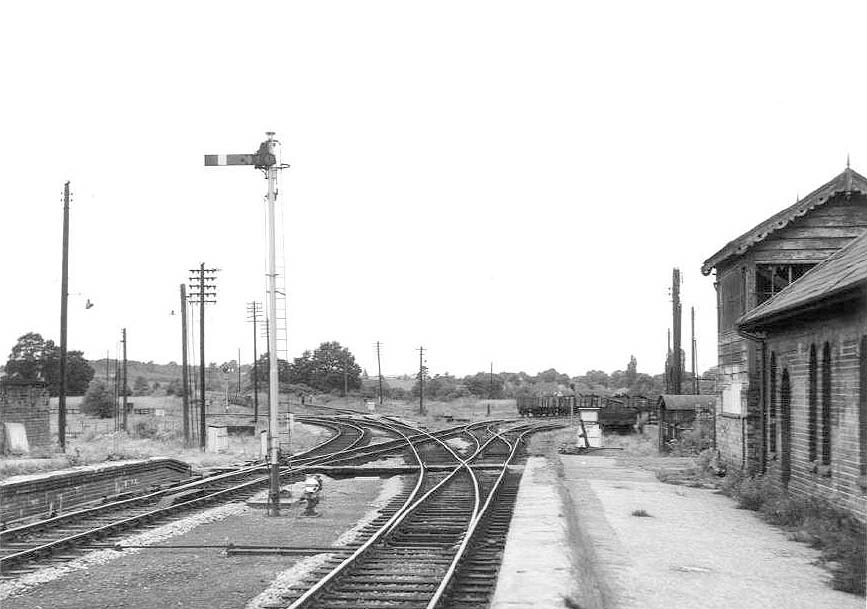 Looking West from the abandoned Stratford on Avon station's up platform with the connecting line to Honeybourne on the left on 18th August 1962