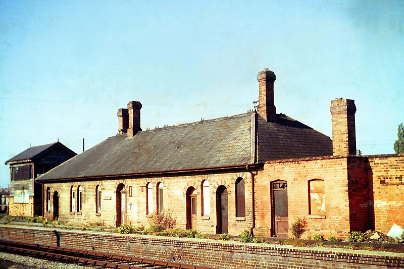 View on 12th October 1963 of the derelict original signal box and station after the removal of its second canopy
